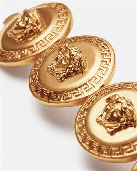 versace v brooch|Versace hair clips.